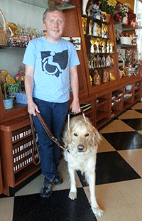 Chris Cooley and his service dog, Conrad