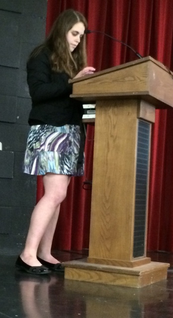 Jordyn Zimmerman uses her iPad to speak to the Mentor School Board.