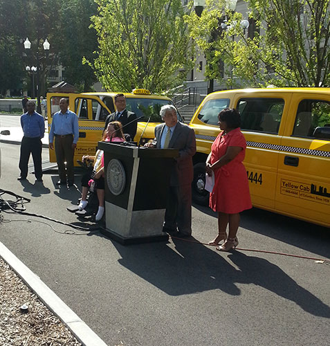 Jeff Kates, president of Yellow Cab of Columbus, speaks at official unveiling of accessible taxi cabs on July 24.