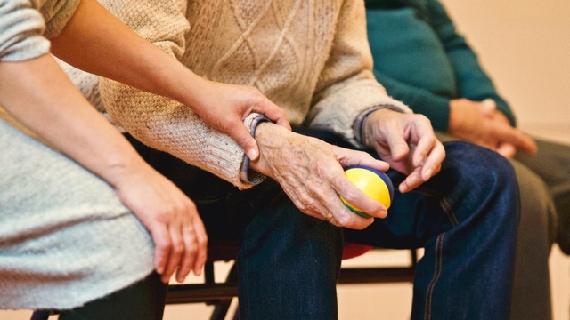 Older_man_holding_a_ball