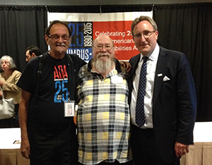 Photo-documentarian for the disability rights movement Tom Olin (left), DRO Board member Pat Risser (center), and Andrew Imparato (right), Executive Director of the Association of University Centers on Disabilities celebrate the 25th anniversary of the ADA in Columbus. 